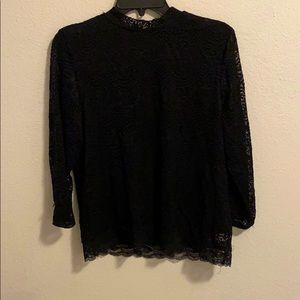Lace, turtleneck blouse.